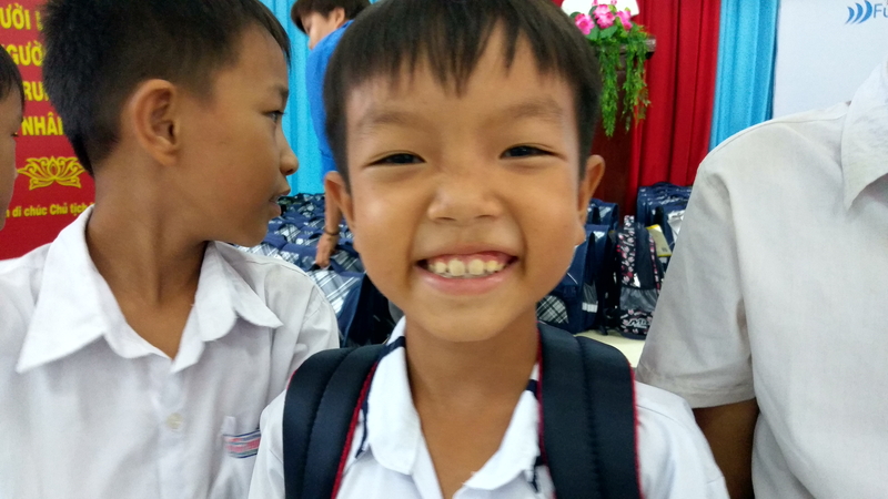 Children smiles with school bag